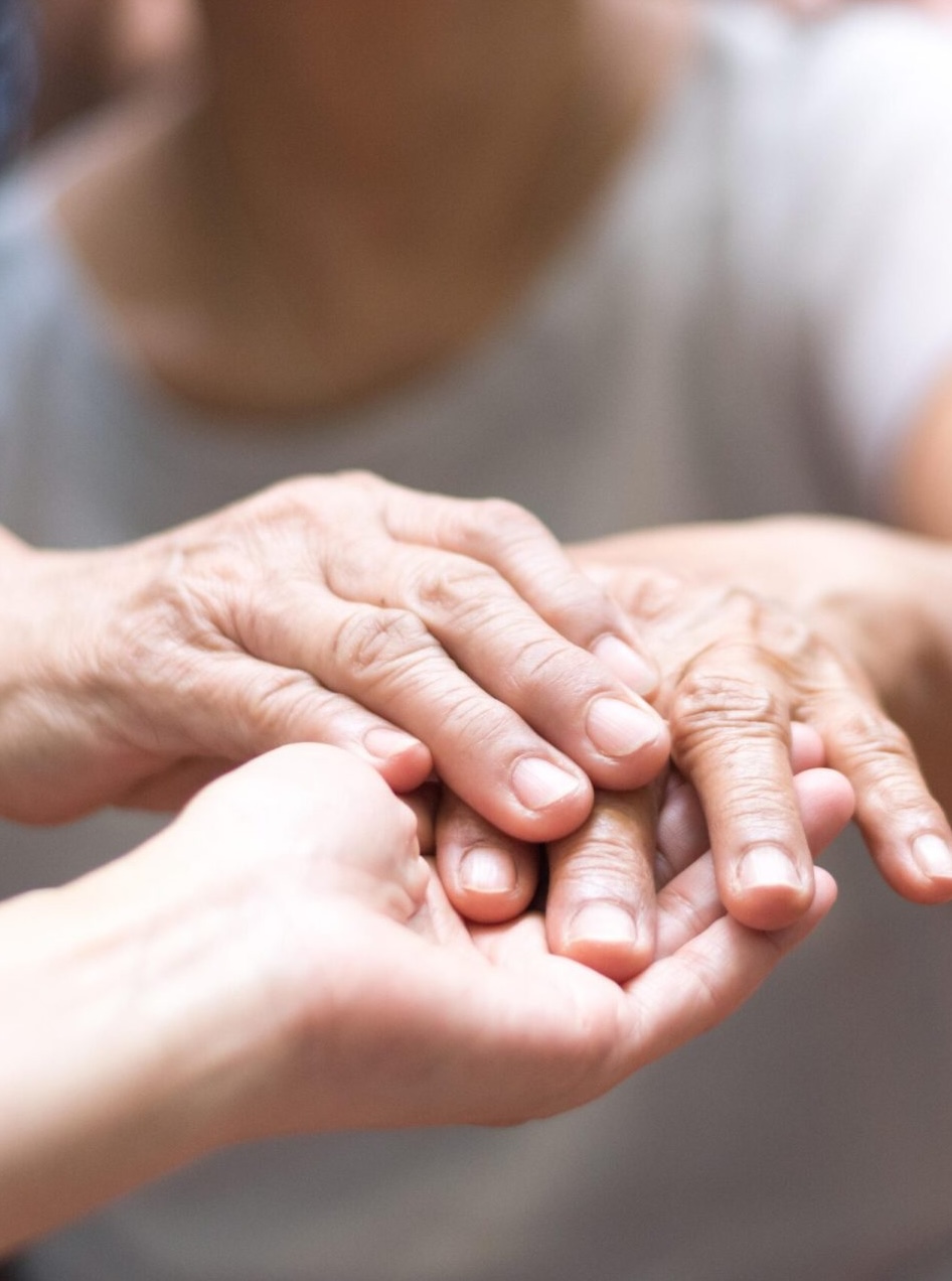Physical therapist assisting a parkinson patient with rehabilitation exercises